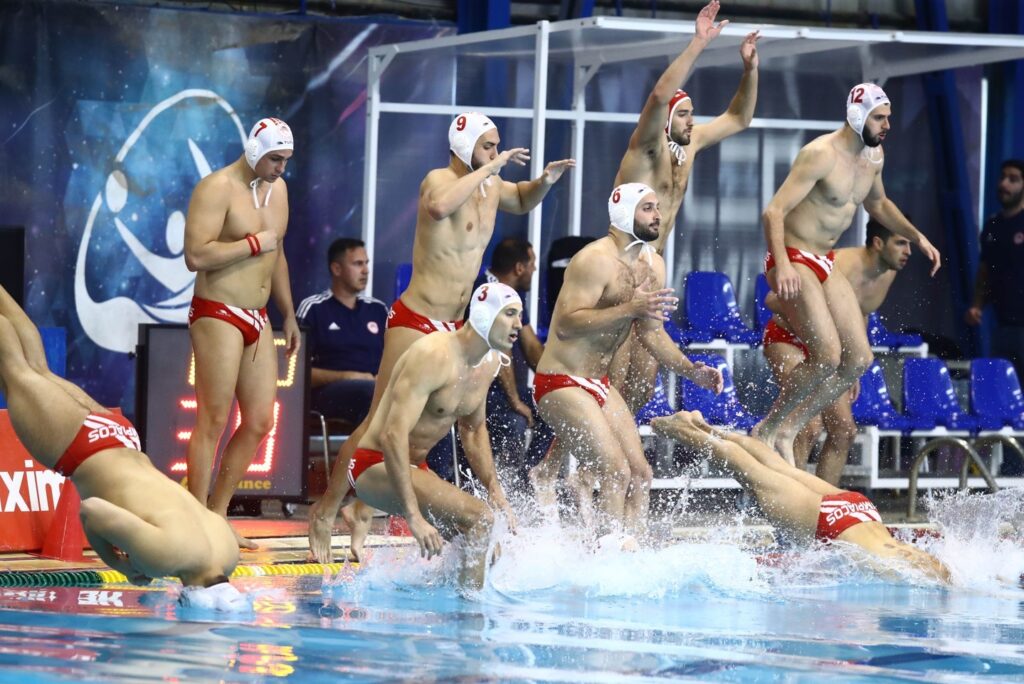 Photo by Olympiacos Piraeus on May 23 2024. May be an image of 8 people people swimming and text